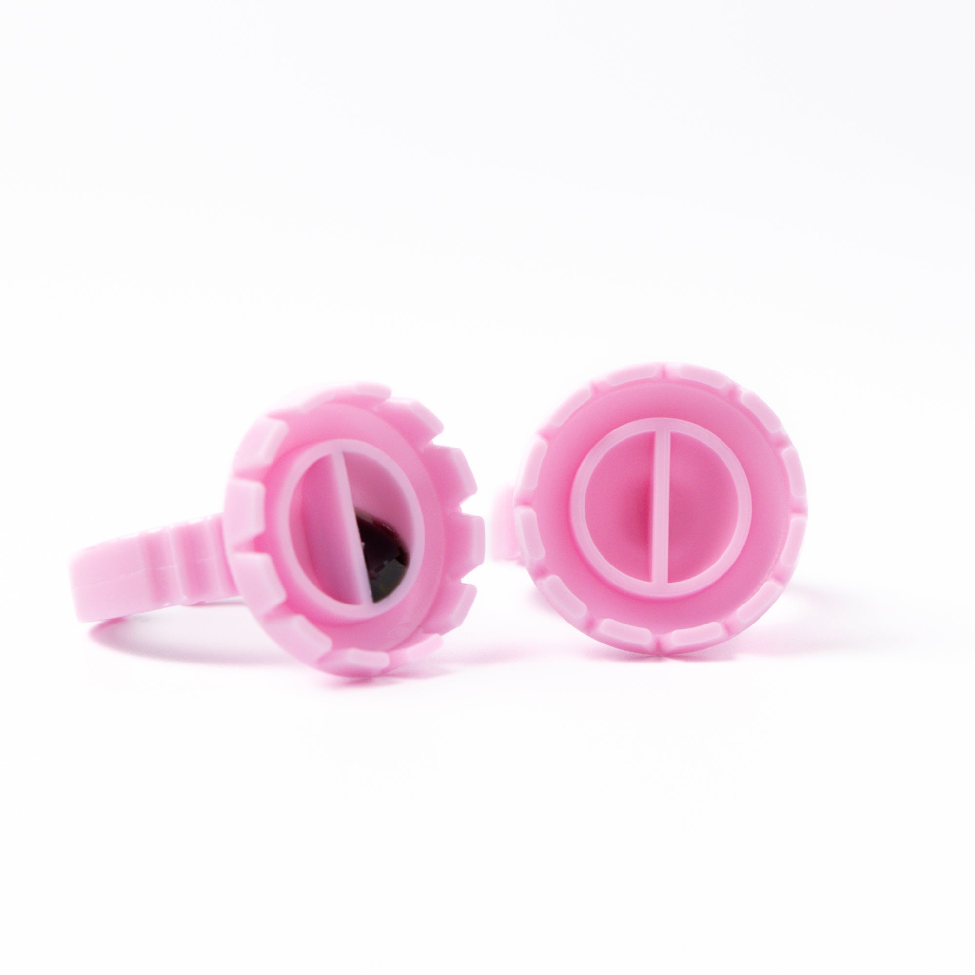 Two Pink Glue Rings over a white background.
