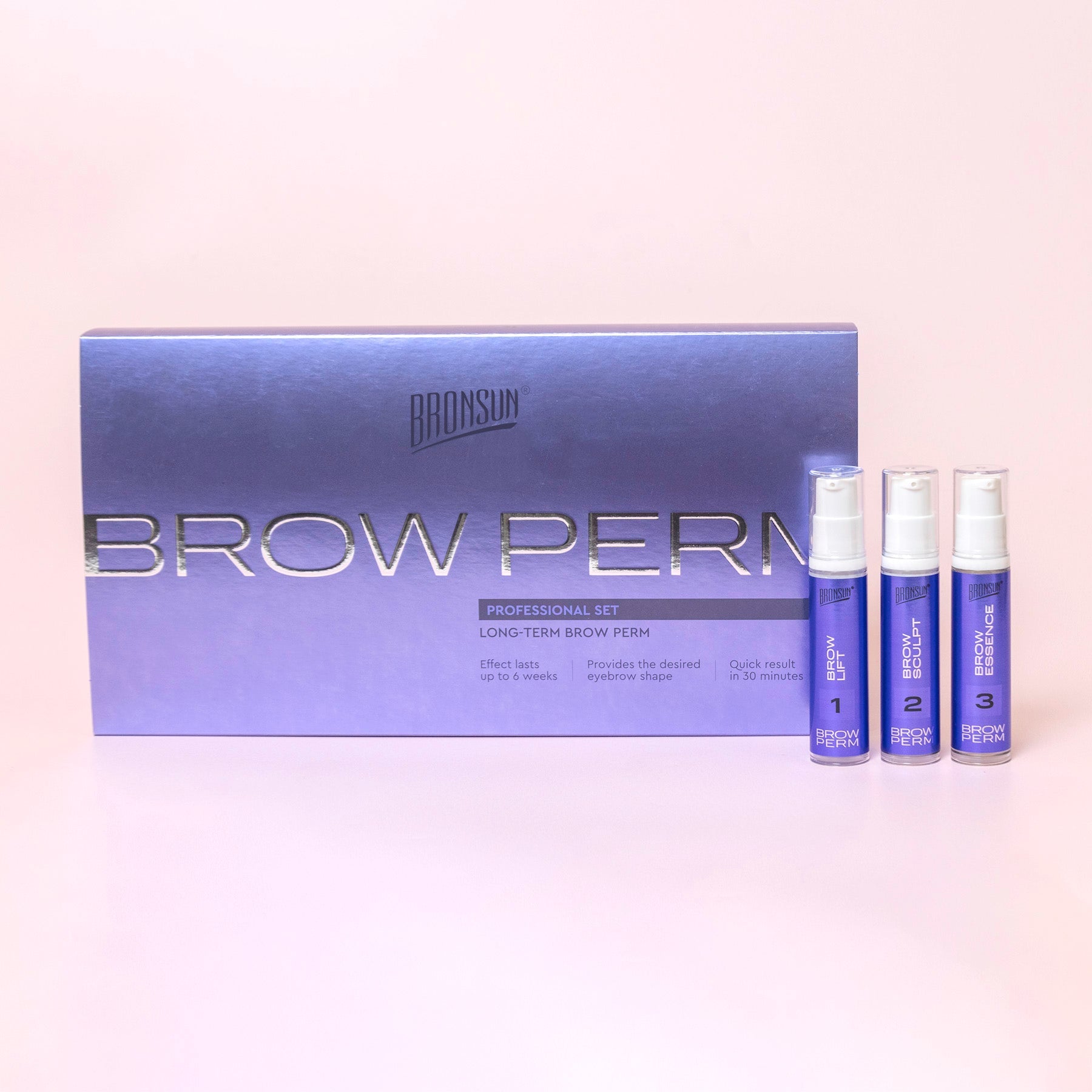 Long-term brow perm product display over a pink background.