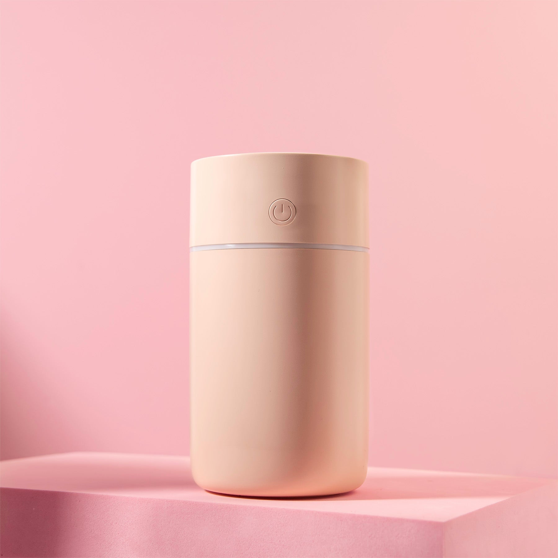 Image of the humidifier with a pink background.