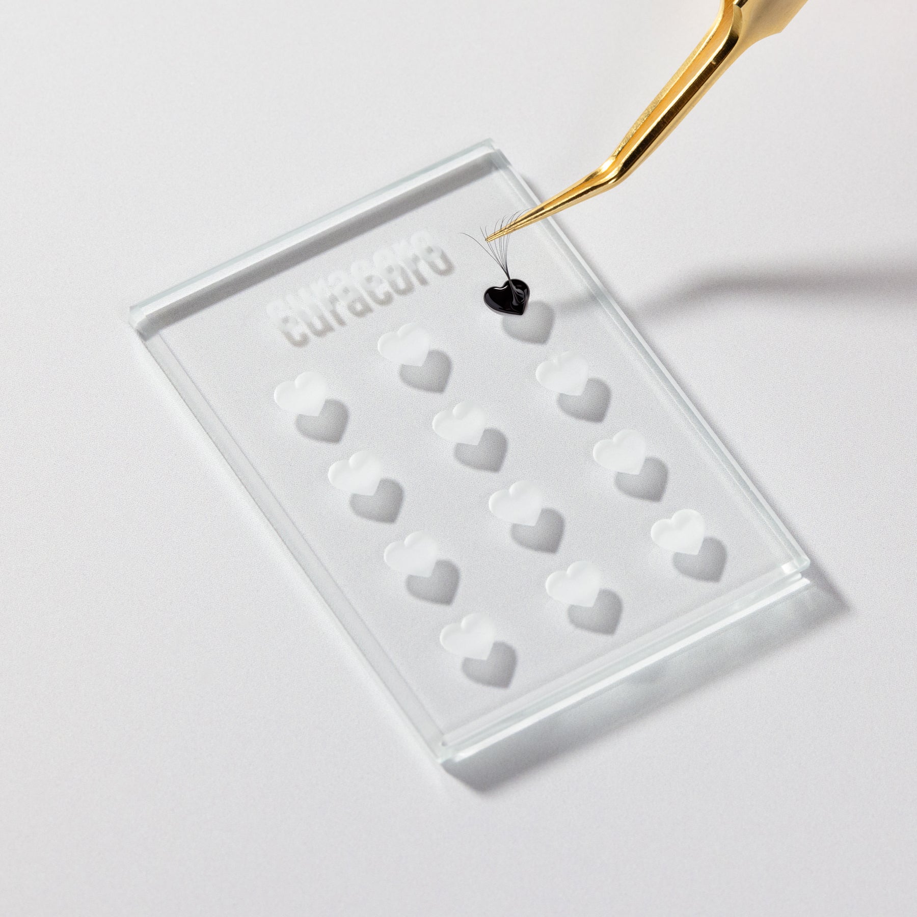 Crystal Glue Holder with Liquid Glue and Tweezer Over White Background