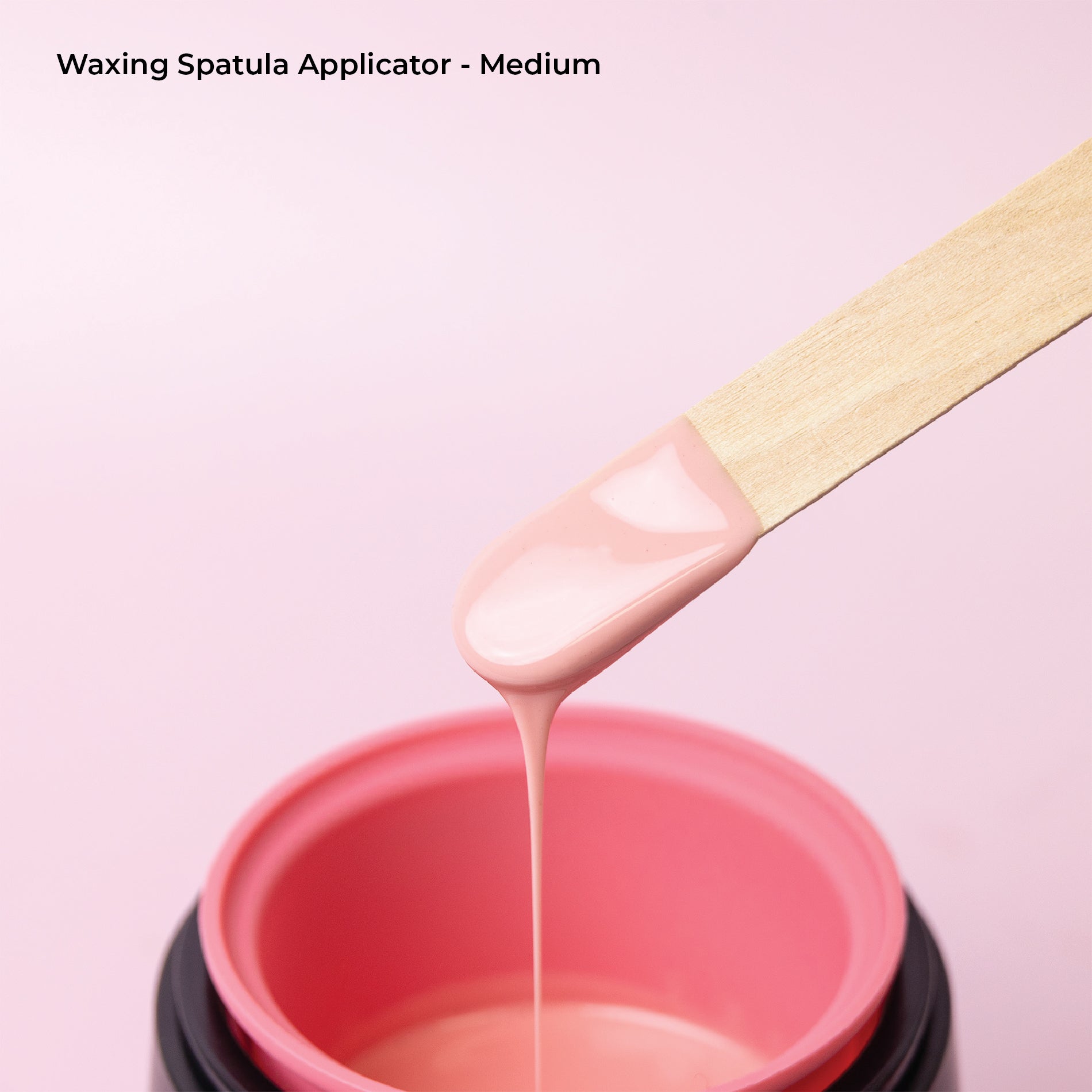 Using medium spatula to pick up wax.