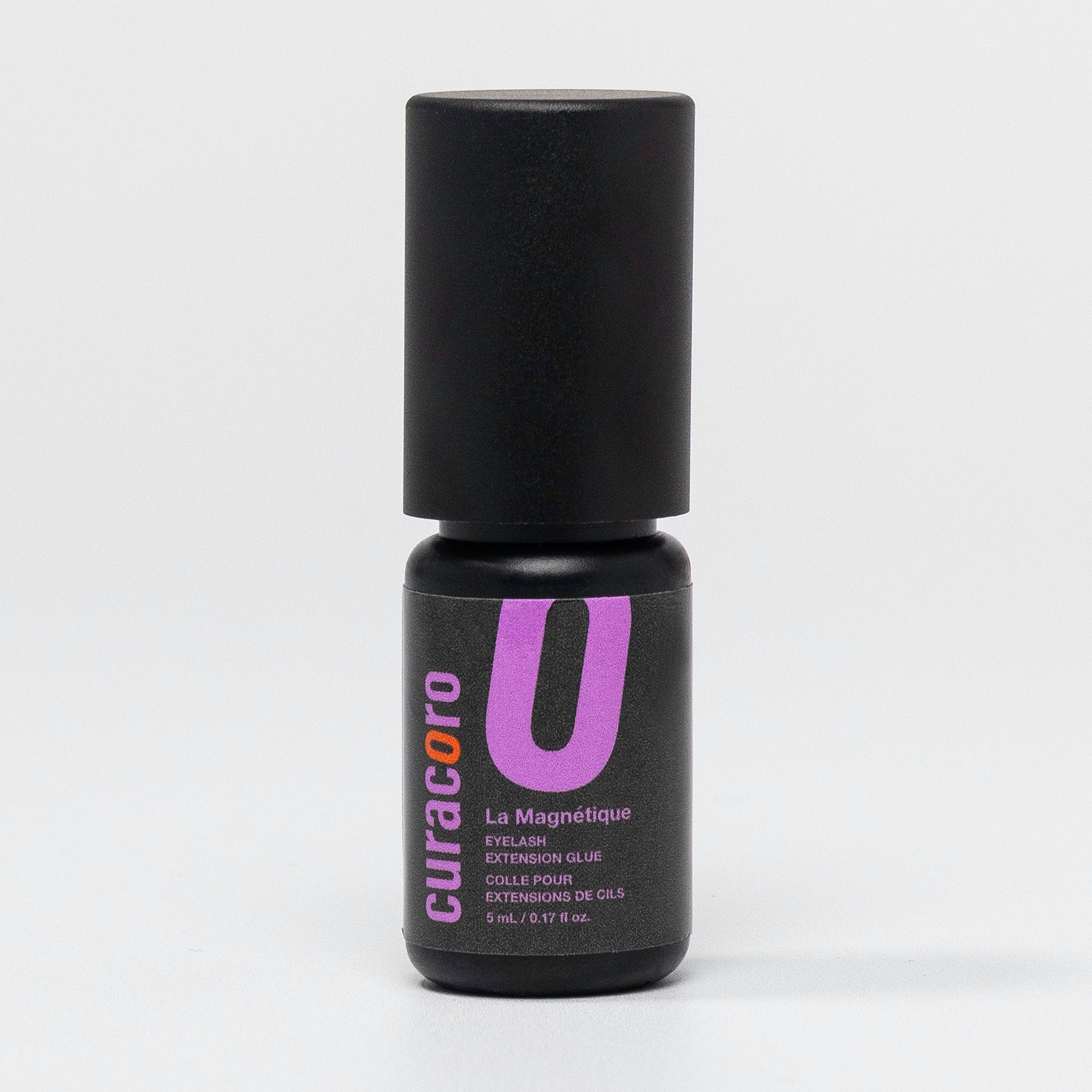 Curacoro La Magnétique Eyelash Extension Glue bottle over a white background.