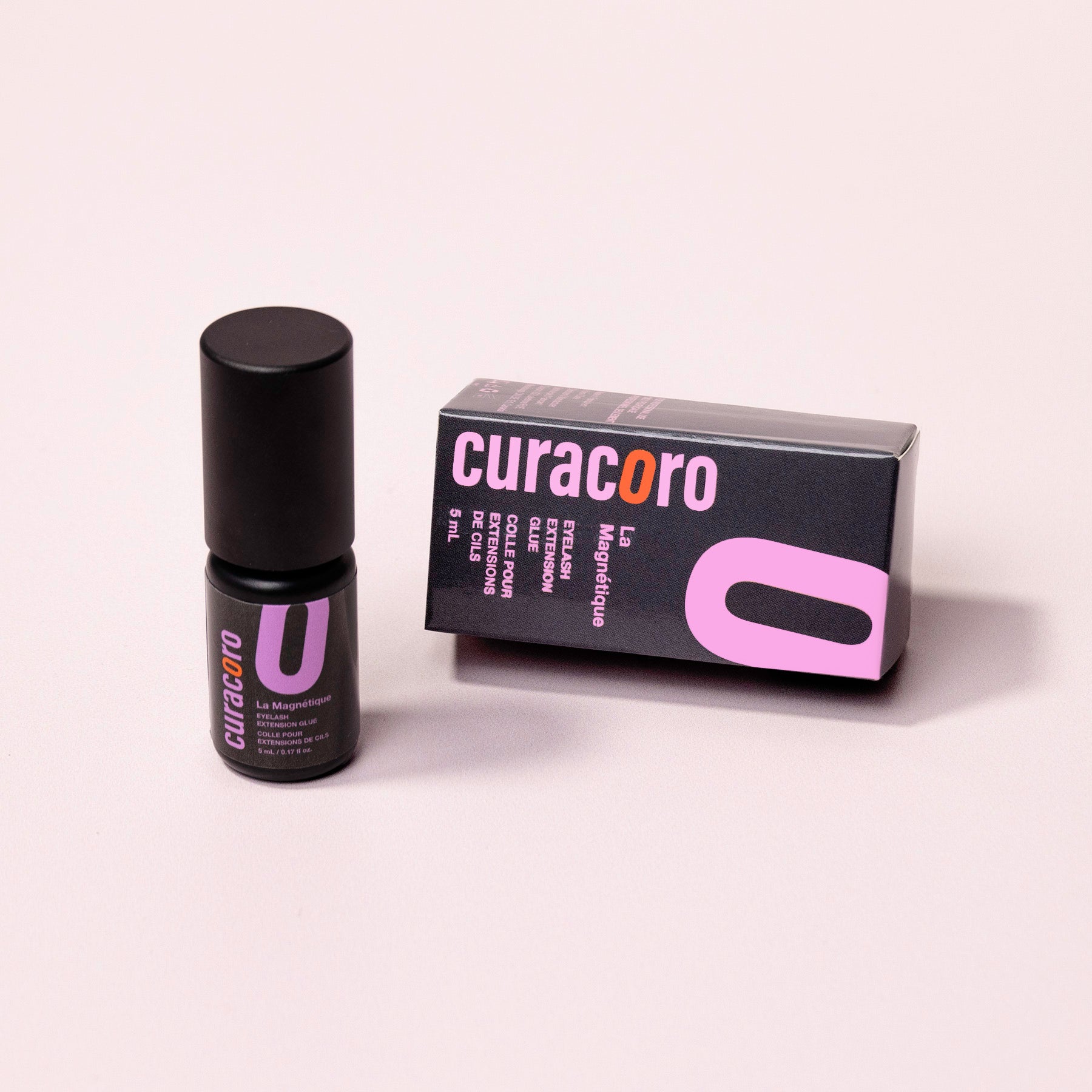 Curacoro La Magnétique Eyelash Extension Glue bottles displayed on a white background, with its packaging.