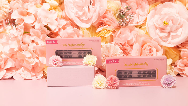 Two Date Night Ready lash kits displayed against a backdrop of pastel pink and peach flowers, with delicate flowers placed in front for a romantic aesthetic.