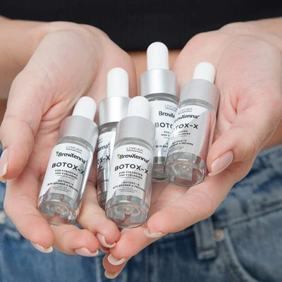 BrowXenna® Botox-X, 10 ml bottles held in hands