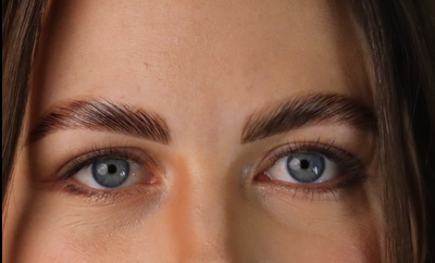 Laminated brows after nourishing serum treatment on a model. 