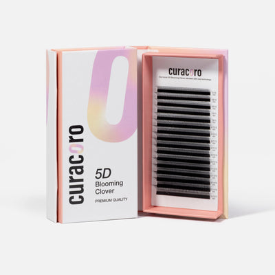 An open box of Curacoro 5D Blooming Clover premium quality eyelash extensions in black.