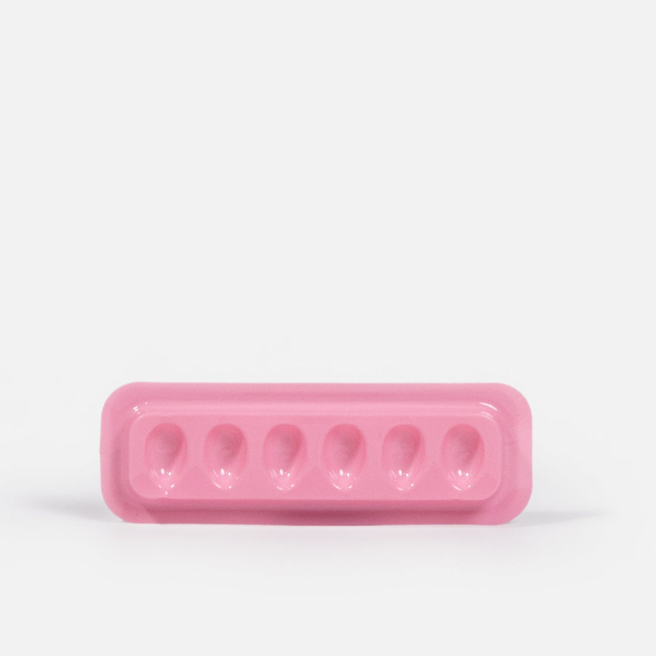 Individual Disposable Glue Holder Over White Background