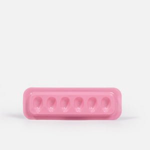 Individual Disposable Glue Holder Over White Background