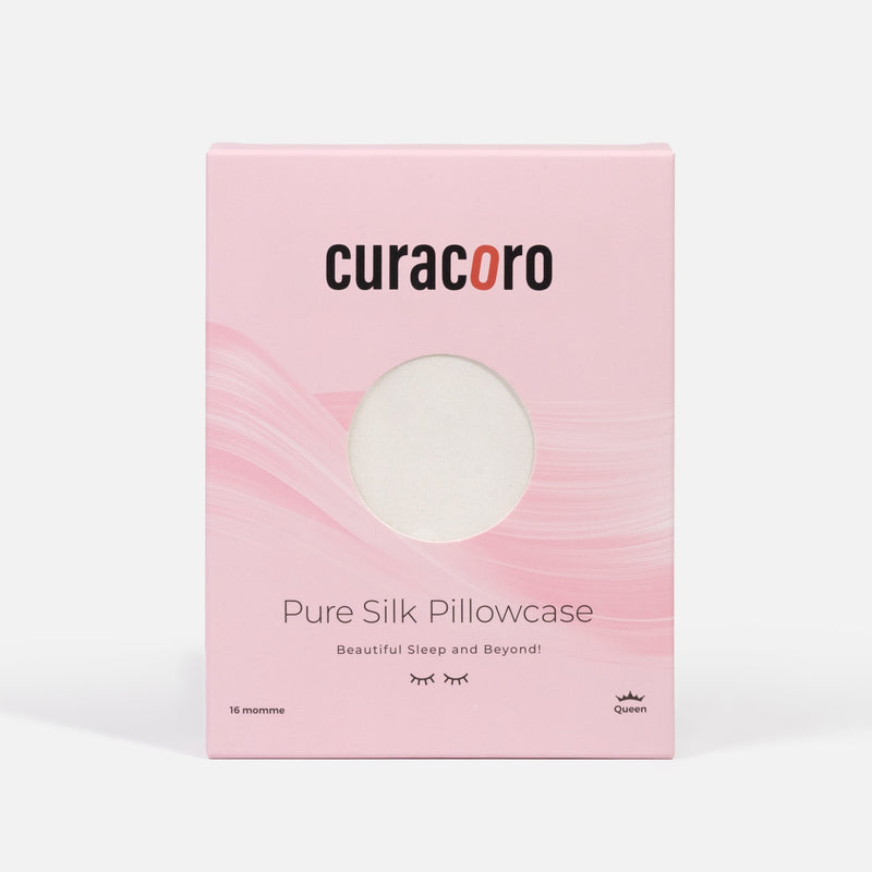 Curacoro Pure Silk Pillowcase in Himalayan Silky white, queen size, packaged in a soft pink box.