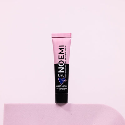 Noemi Hybrid Lash Dye - Blue Night Bottle Over Pink Background