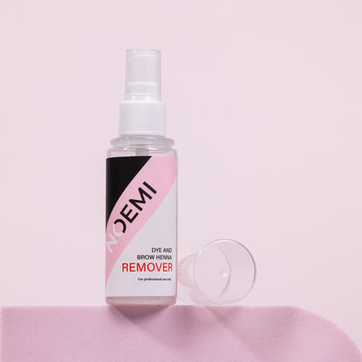 Noemi Remover Bottle Over Pink Background