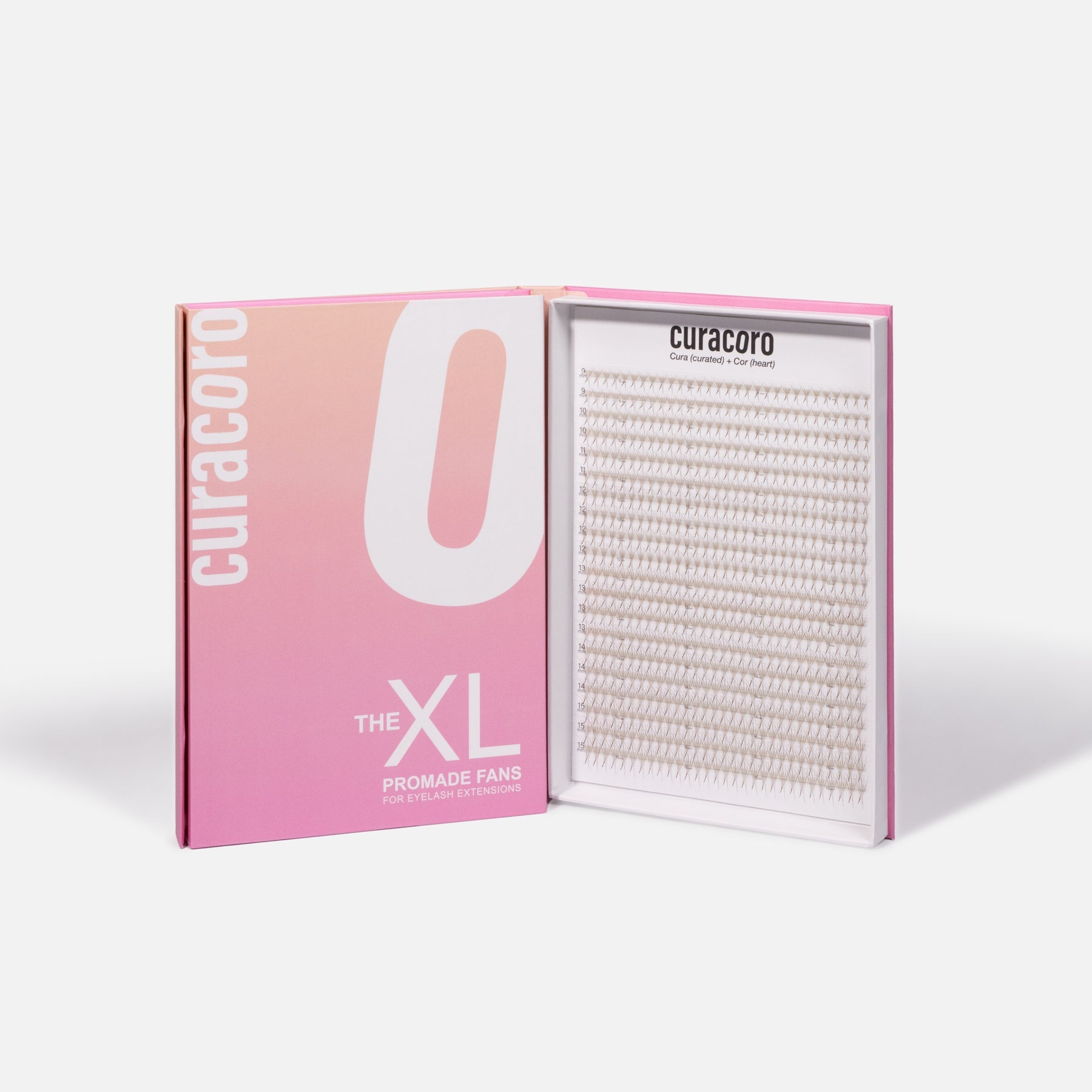 An open pink and white box labeled "The XL Promade Fans," displaying neatly arranged lash fans on a white background.
