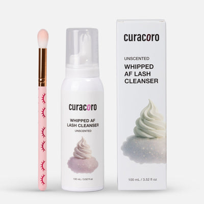 Curacoro lash cleanser with applicator and packaging on a white background