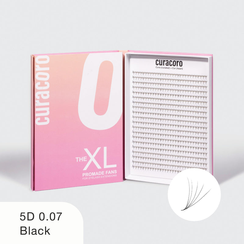 Curacoro XL Promade Fans in 5D 0.07 thickness, Black. The elegant packaging features a gradient pink design with an open tray showcasing high-quality eyelash fans.