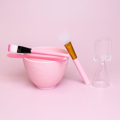 Face Mask Mixing Bowl kit in front of a pink background.