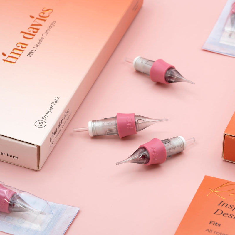 PIXL Needle Cartridges and packaging displayed on a pink background