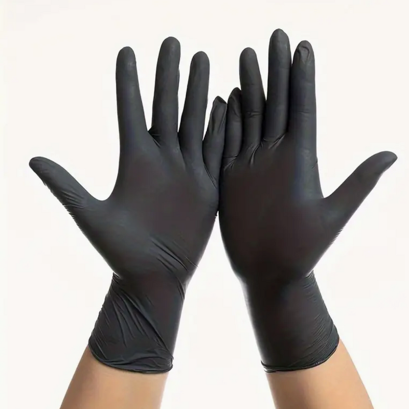 Hands wearing black nitrile gloves raised against a white background.