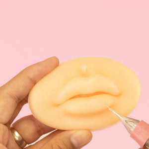 White style of 3D Silicone Lips standing in front of a pink background.