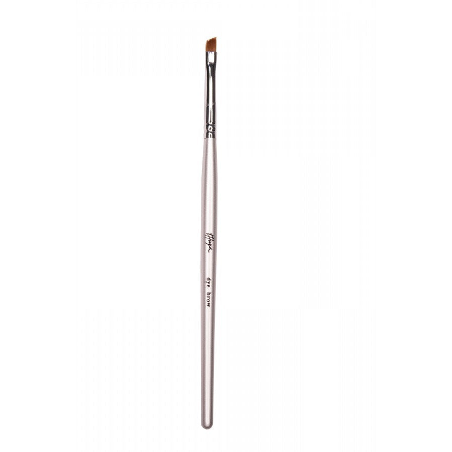 Thuya Dye Brow Brush with a sleek silver handle and angled bristles, designed for precise application of eyebrow dye.