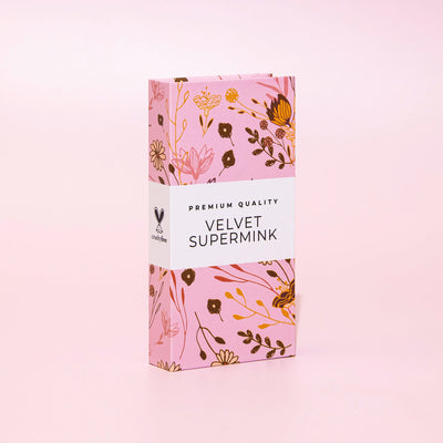 Curacoro Velvet Supermink packaging with a floral design on a pink background, labeled 'Premium Quality' and 'Cruelty-Free.