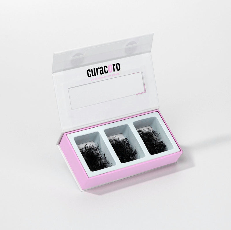 Curacoro 3-in-1 pro-made fan lashes in black, displayed in an open case with three compartments for volume lash extensions.