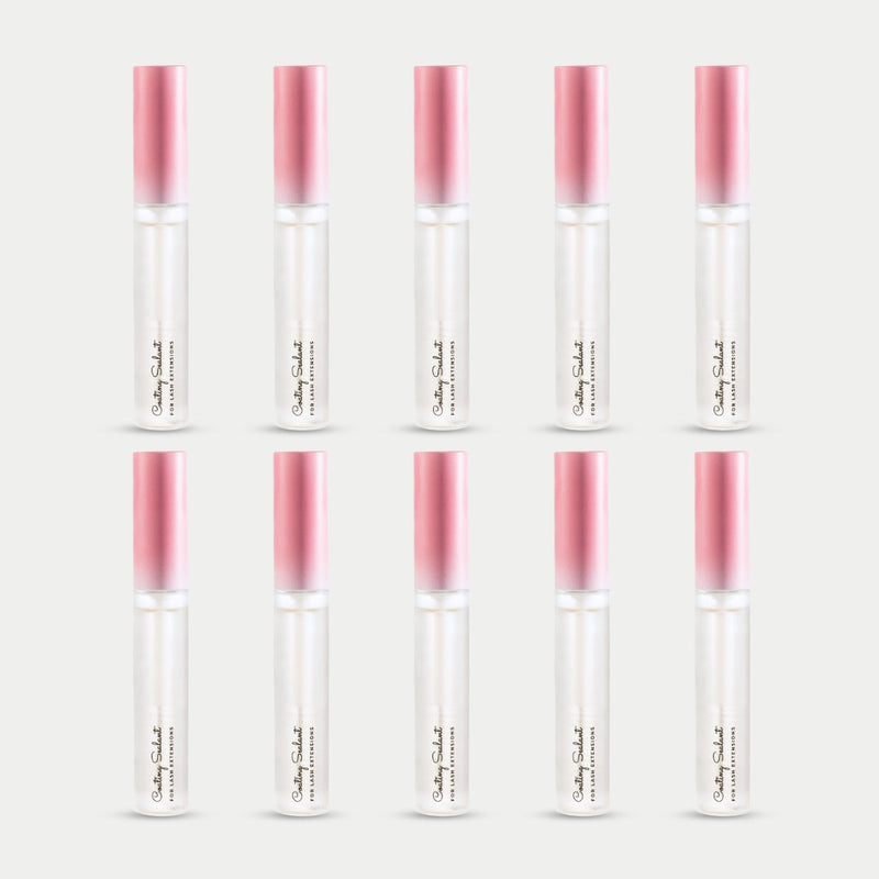 ten bottles of Curacoro Coating Sealant for lash extensions, featuring a sleek design with a gradient pink cap.