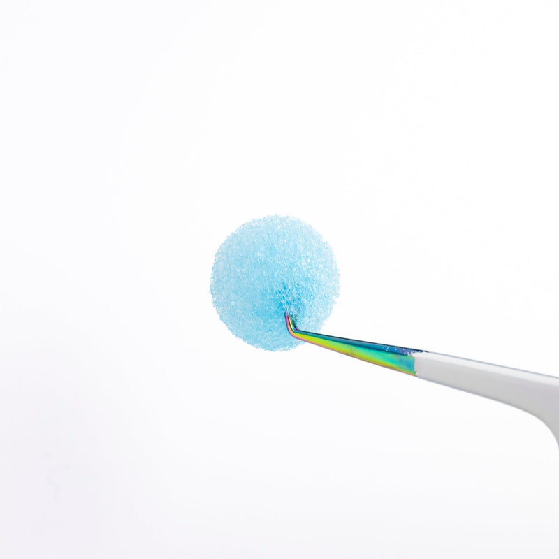 Tweezer Sponge Cleanser Hold by a Tweezer Close Up