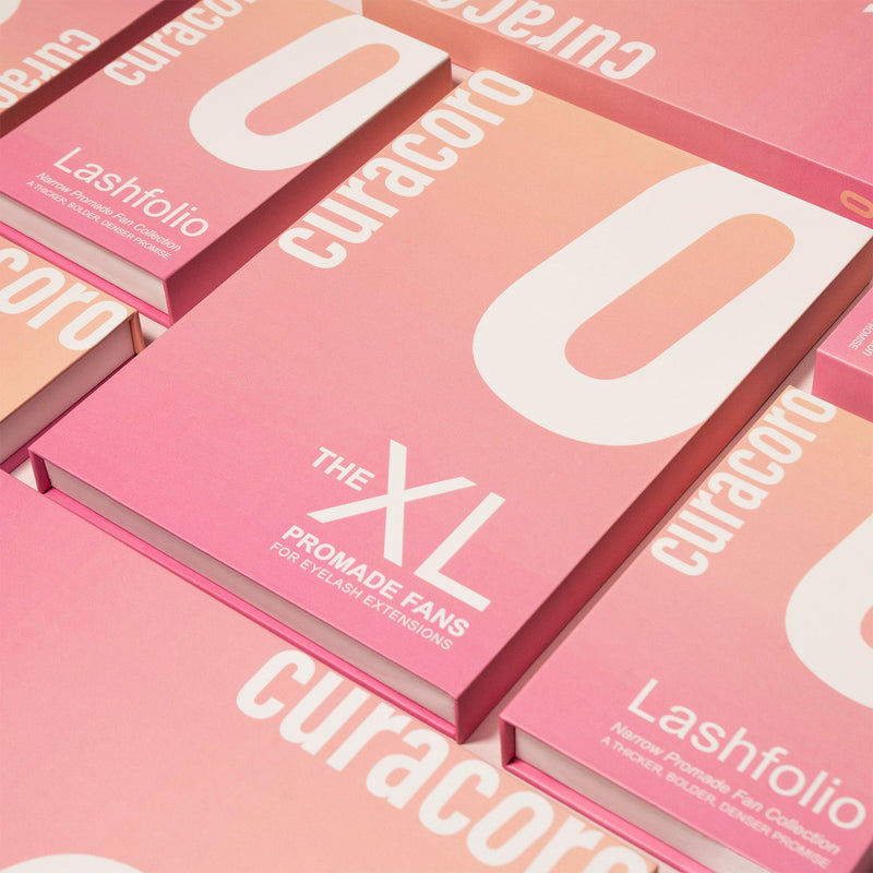 Curacoro XL Promade Fans Lashfolio boxes in a pink gradient design.