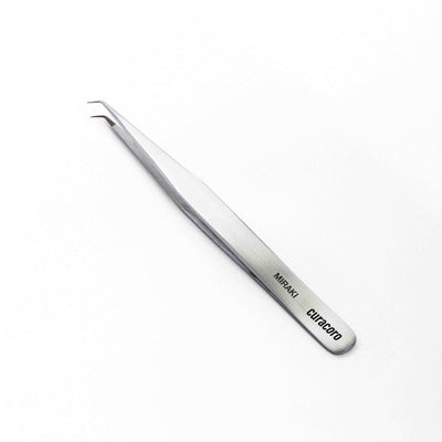 Curacoro Miraki tweezers, precision-crafted for professional eyelash extension applications, featuring a sleek, ergonomic design.