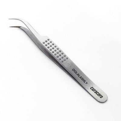 Curved stainless steel eyelash extension tweezer with a precision tip, textured grip handle, and engraved branding 'Curacoro' and 'OohLaLashly' on a white background.