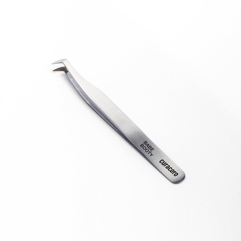 Babe Booty Tweezer Silver over a white background. 