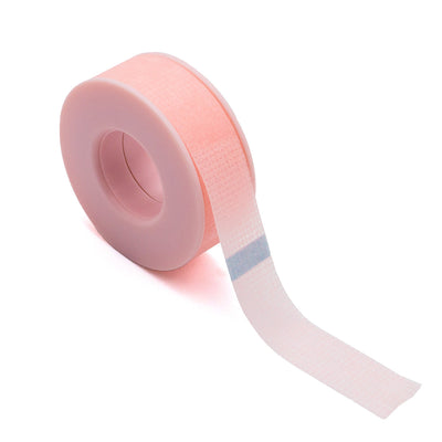 Curacoro pink eyelash extension tape roll with soft silicone core, partially unrolled, displayed on white background